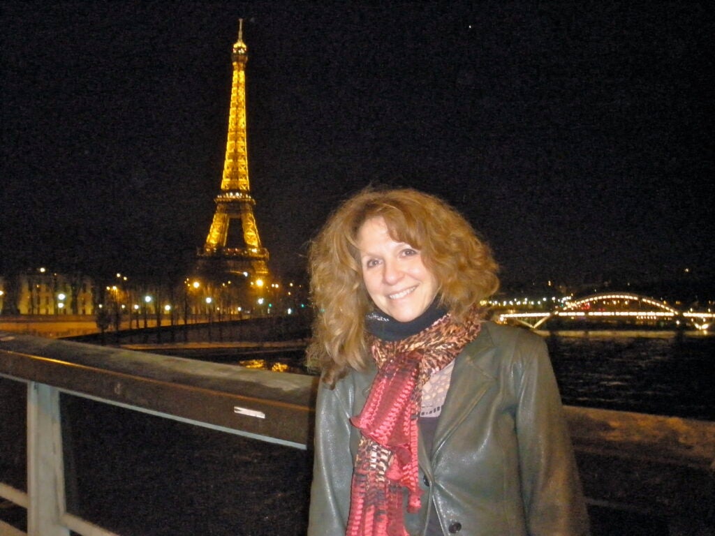 Sharon Carr in front of the Eiffel Tower.